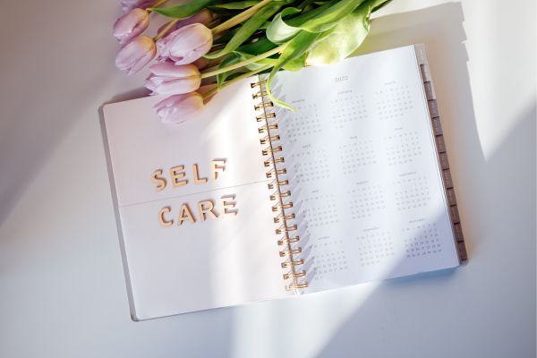 Open calender with a text Self-care